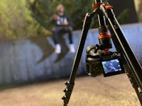 a tripod with a camera attached to it